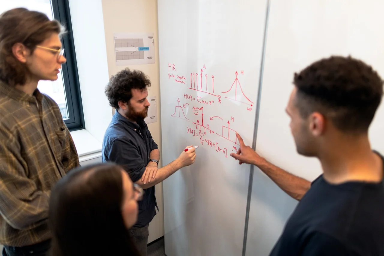 Engineering colleagues reviewing technical data together